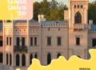 Attēlā redzama gaiši rozā Alūksnes Jaunā pils ar torni un dekoratīviem logiem. Uz attēla ir uzraksti: "Gada balva '26", "Pamanāīts", "Alūksnes novada muzejs", "Par darbu ekspozīcijas "Aizsapņošanās" izveidē".