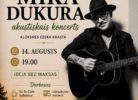 Mika Dukura akustiskā koncerta reklāmas plakāts ar nosaukumu "Skaistākais vasaras koncerts", kas notiks "ATPŪTAS KOMPLEKSĀ JAUNSĒTAS ALŪKSNES EZERA KRASTĀ 14. AUGUSTS 19.00". IEEJA BEZ MAKSAS. Darbosies "Es Te Cafe" kafejnīca un izbraukuma treileris. Plakātā attēlots mākslinieks Mika Dukurs, kurš spēlē akustisko ģitāru, un saulrieta ainava virs ezera ar priežu ieskautu ceļu.